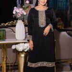 black stonework dress